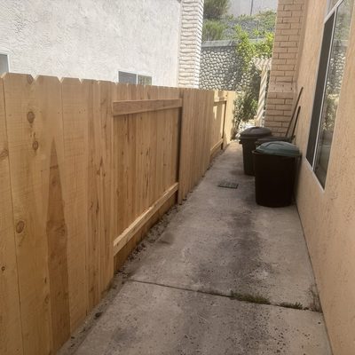 Cedar good neighbor fence running along a side yard walkway